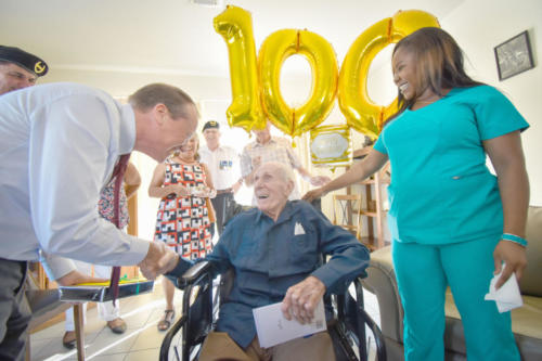 Cayman Islands Governor Martyn Roper wishes the islands' first governor, Athelstan Charles Long, a happy 100th birthday on Wednesday. - Photo: Alvaro Serey